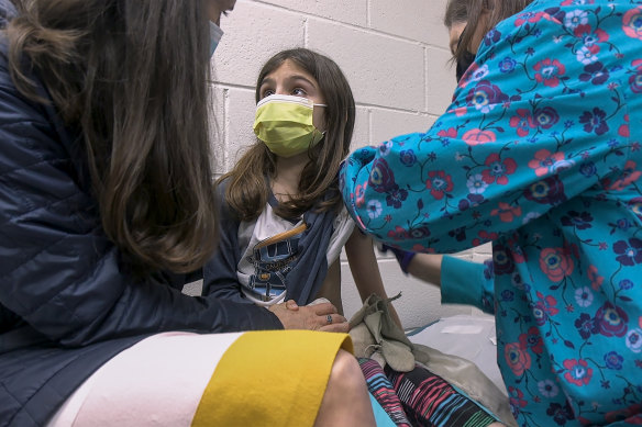 Alejandra Gerardo, 9, gets the first of two Pfizer COVID-19 vaccinations during a clinical trial for children at Duke Health in North Carolina in the United States.