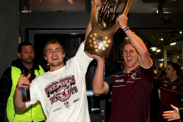 Kieran Foran and Daly Cherry-Evans arrive at the Manly Leagues Club with the NRL trophy in 2011.