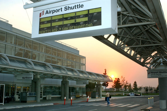 A lone traveller walks through Ontario International Airport in California.