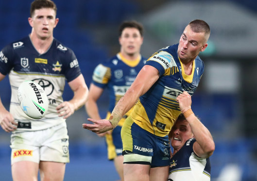 Eels fullback Clint Gutherson gets a deft pass away against the Cowboys on Saturday night.