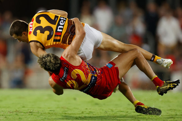 In his grasp: Hawthorn’s Finn Maginness is tackled by Izak Rankine.