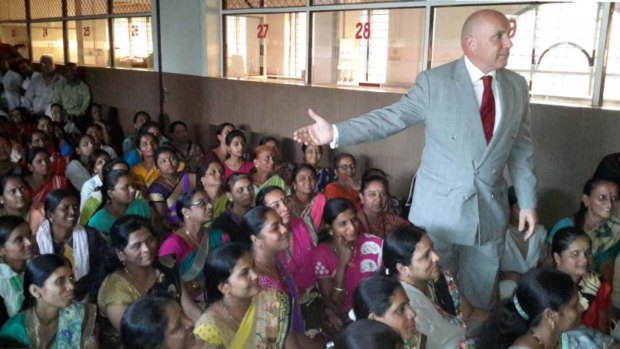 Barrister Niall Coburn addresses victims of the Pearls alleged Ponzi scheme in Pune, India.