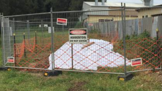 The dumped asbestos on Mineral Road, Oak Flats was fenced off before being removed within days.