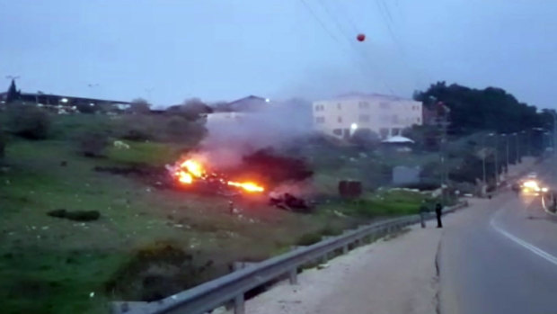 The wreckage of a jet on fire near Harduf, northern Israel.