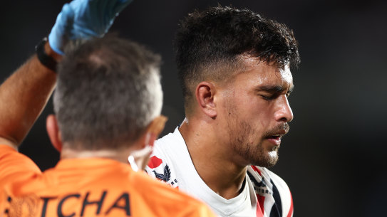 Joseph Suaali’i leaves the field on Friday night after taking a knock to the head.