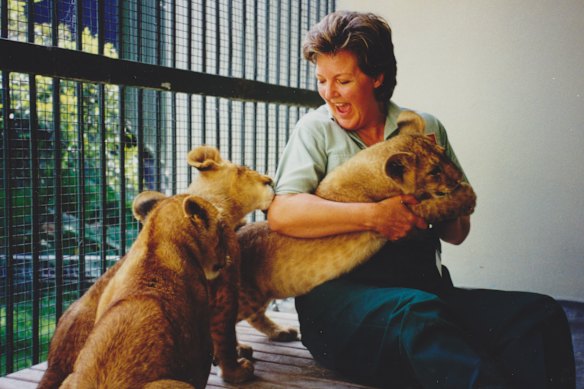 The author with African lion cub
triplets Bruiser, Shinyanga and Njeri, in 2000. “Every day was different and exciting, even if the lunchroom was heavy with testosterone,” she says of her time as a keeper.