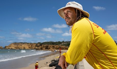 Lifeguard Mark Scotland scans the surf at Torquay.