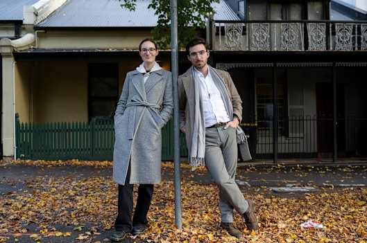 The YIMBY group’s Katie Roberts-Hull and Jonathan O’Brien in front of some terrace homes in Carlton.