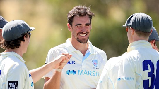 Mitchell Starc and the Blues celebrate a a wicket against Tasmania.
