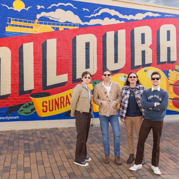 Kings of Leon, l-r: Matthew Followill (lead guitar), Caleb Followill (lead vocals, guitar), Nathan Followill (drums) and Jared Followill (bass) in front of the Mildura mural.