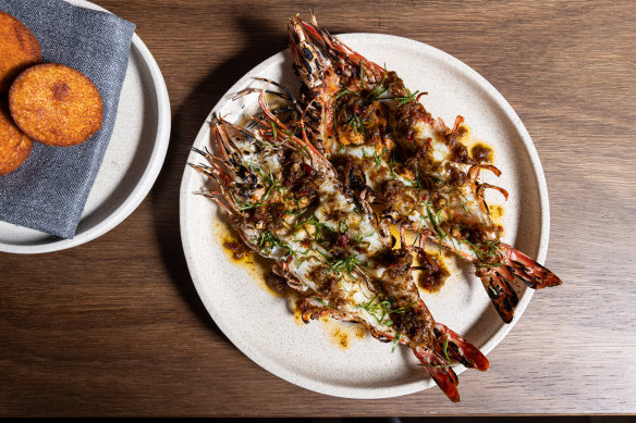 Go-to dish: Tiger prawns, jungle curry, brown butter, pictured with a side of idli (steamed rice and lentil cakes).