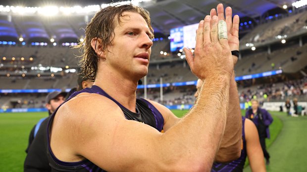 Nat Fyfe of the Dockers acknowledges supporters after winning the round 14 AFL match between North Melbourne Kangaroos and Fremantle Dockers at Optus Stadium.
