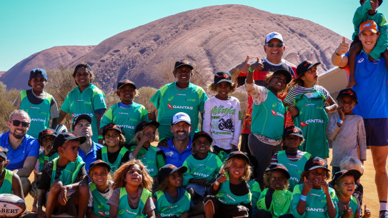 Young Indigenous kids try their hand at rugby at Uluru.
