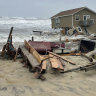 n this image provided by National Park Service, a beach house that collapsed along North Carolina’s Outer Banks rest in the water on Tuesday, May 10, 2022, in Rodanthe, N.C. The home was located along Ocean Drive in the Outer Banks community of Rodanthe. The park service has closed off the area and warned that additional homes in the area may fall too.   (National Park Service via AP)