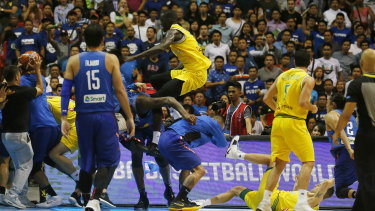 Ugly scenes: Boomers player Thon Maker flies at a Philippines player.