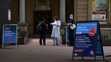 Staff wearing face masks outside the Royal Prince Alfred Hospital (RPA) in Camperdown, Sydney.