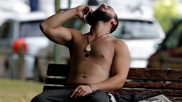 A man speaks on a mobile phone outside a mosque in central Christchurch.