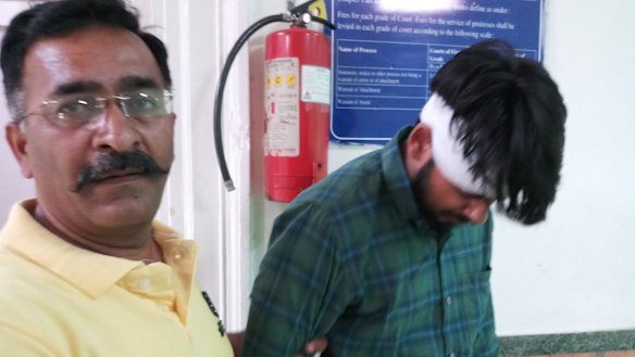 Hit-run driver Puneet Puneet (right) leaves court with his uncle in New Dehli in June.