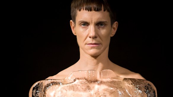 Fire and ice: Cassils performing their second work at Dark Mofo, Tiresias, in which they stand against a classical male bust carved from a slab of ice.