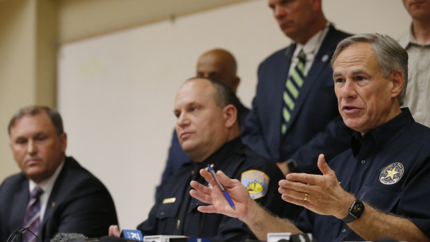 Texas Governor Greg Abbott gestures during a news conference after the shooting. 