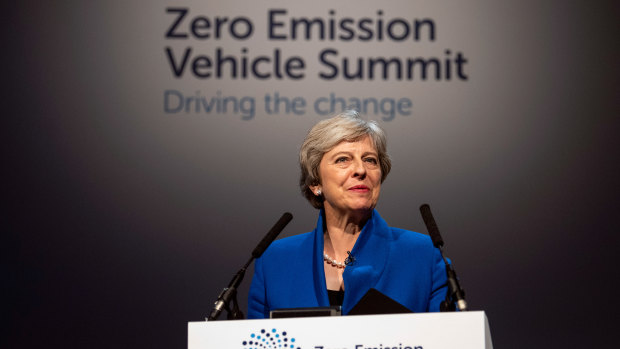 Theresa May delivers a speech at the Zero Emission Vehicle Summit in Birmingham last year.