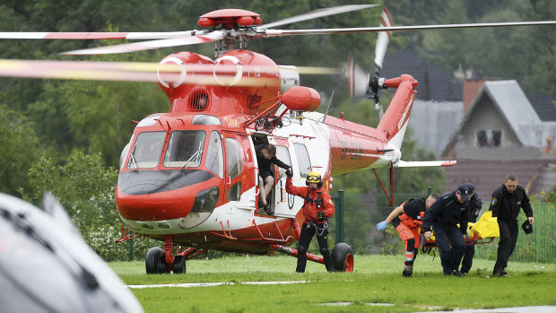 A rescue helicopter brings the first patients to hospital after lightning struck the Tatra Mountains.
