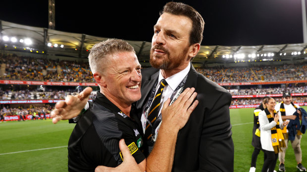 Richmond's senior coach Damien Hardwick (left) and CEO Brendon Gale celebrate the club's third AFL premiership in four years.