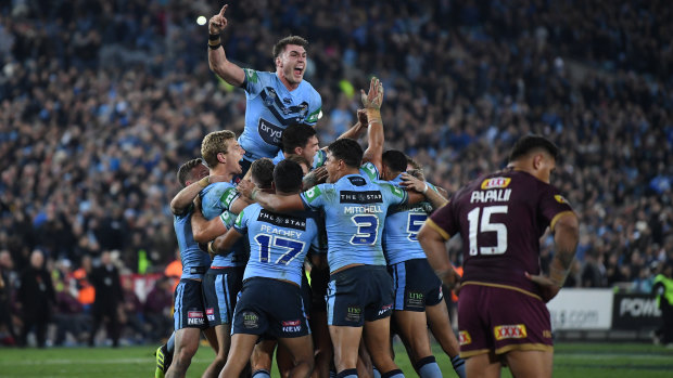 New South Wales celebrate their victory over Queensland.