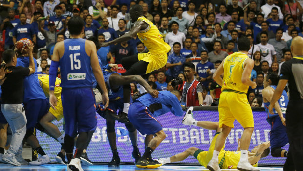 Boomers player Thon Maker tries to high kick a Philippines player.