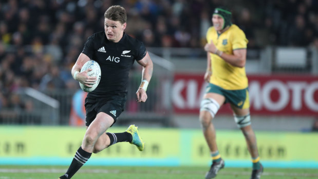 Rare feat: Beauden Barrett breaks up the middle to score one of his four tries against Australia.