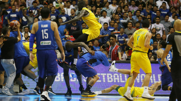 Boomers player Thon Maker flies at a Philippines player.