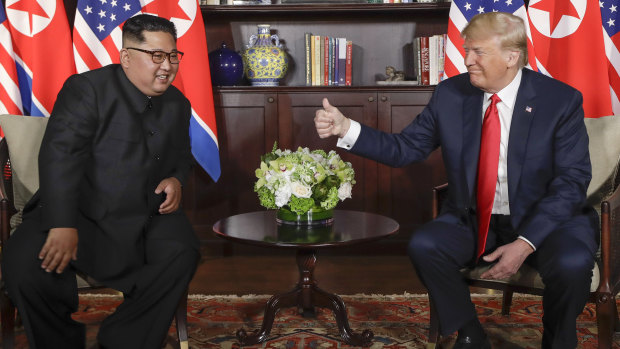 US President Donald Trump gives North Korean leader Kim Jong-un a thumbs up during their meeting at a resort on Sentosa Island in Singapore on Tuesday, June 12.