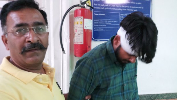Hit-run driver Puneet Puneet (right) leaves court with his uncle in New Dehli in June 2018.