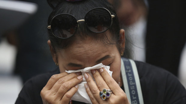 A supporter of the Thai Raksa Chart party cries at the Constitutional Court in Bangkok.