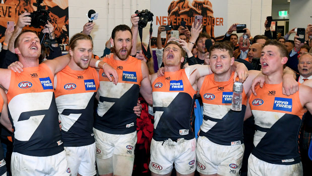 GWS Giants players belt out There's a Big, Big Sound after their win over Collingwood.