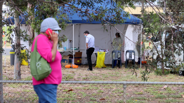 People queuing at the COVID-19 Testing site at Parafield Airport.