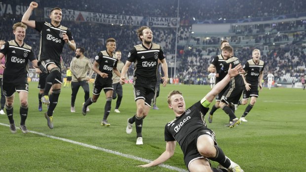Ajax celebrate after their win.