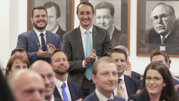 Phil Thompson and Dave Sharma are welcomed by Scott Morrison during a joint party room meeting.