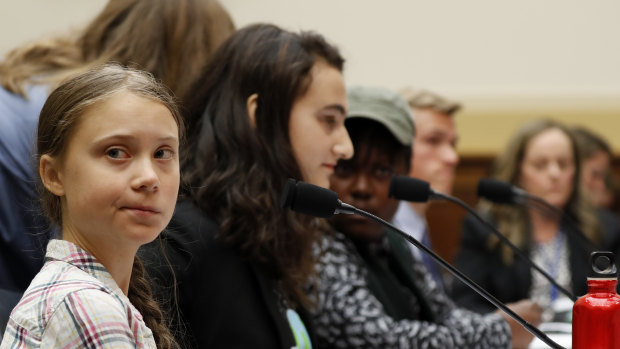 Youth climate change activist Greta Thunberg, left, prepares to speak at a House Foreign Affairs Committee subcommittee hearing on climate change in Washington.
