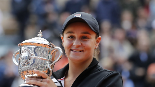 Jubilant: Australia's Ashleigh Barty holds the trophy. 