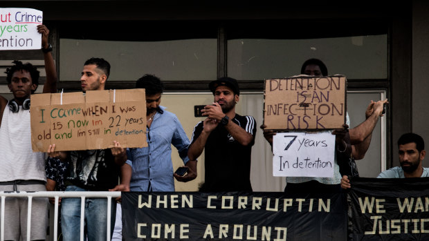 Asylum seekers protest on the balconies of a detention centre in Brisbane. 
