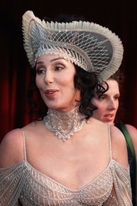 Cher at the 1998 Academy Awards wearing a hat that would be right at home in Moore Park.