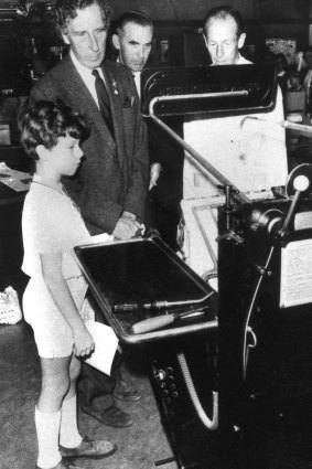 Sir Warwick Fairfax shows his son Warwick jnr the Fairfax printing presses.