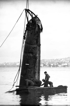 Salvage in June, 1942 of one of the midget Japanese submarines that slipped through a gap in the boom defence nets across the entrance to Sydney Harbour on May 31. 