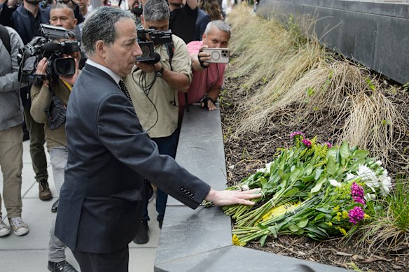 Congressman Jamie Raskin lays flowers outside the Capital Jewish Museum after the shootings.