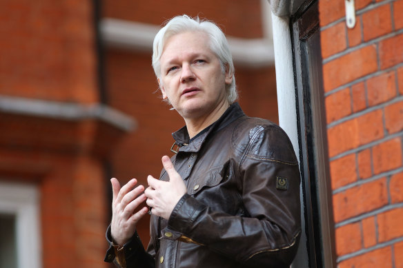 Julian Assange speaks to the media from the balcony of the Ecuador embassy in 2017.