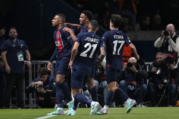 Kylian Mbappe and his teammates celebrate PSG’s opener against AC Milan.