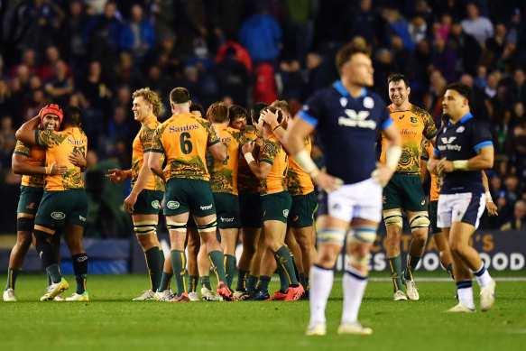 The Wallabies celebrate their win after the final whistle.