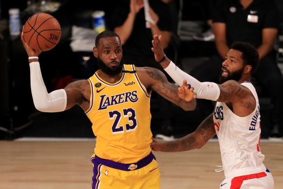 LA's LeBron James passes the ball in the NBA's comeback.