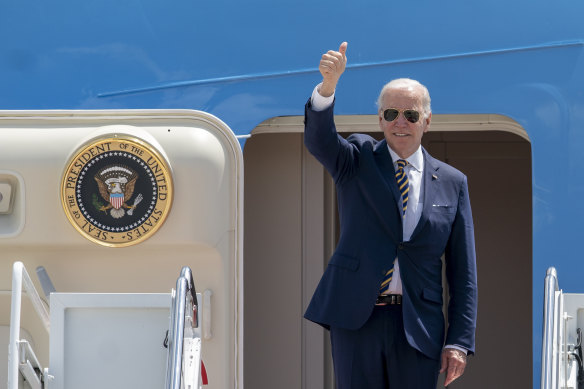 US President Joe Biden gestures as he boards Air Force One for a trip to South Korea and Japan.